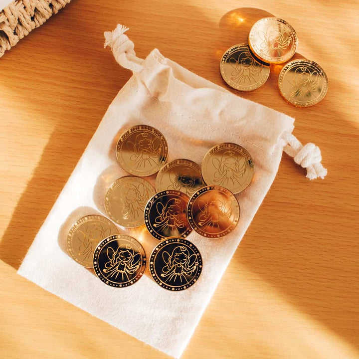 Monedas Hada de los Dientes fuera de la bolsa de tela
