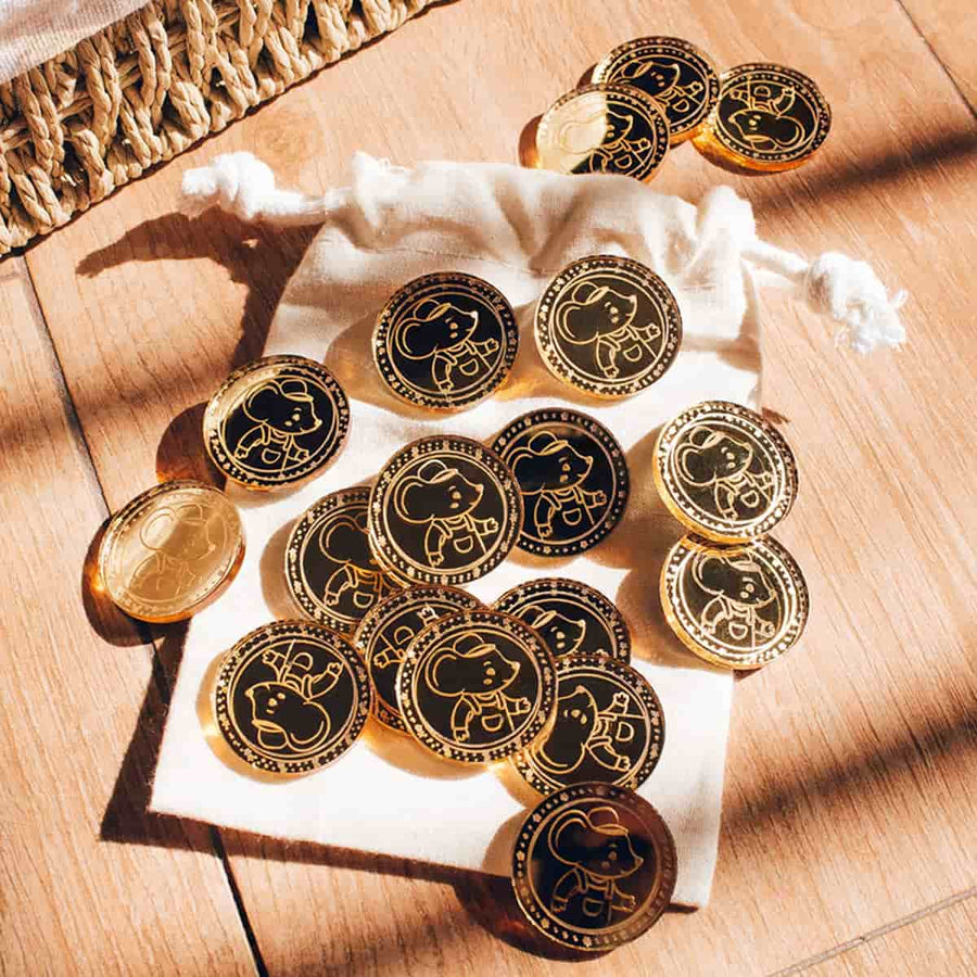 Monedas del Ratoncito Pérez fuera de la bolsa de tela